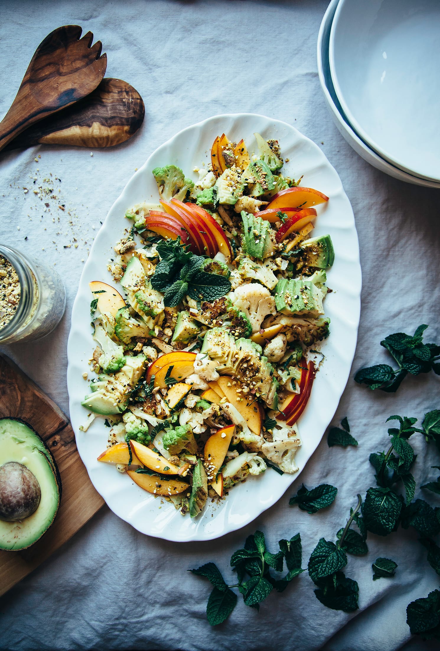 https://thefirstmess.com/wp-content/uploads/2016/07/12-7539-post/cauliflower-nectarine-salad-pistachio-dukkah-avocado-vegan-recipe-7.jpg