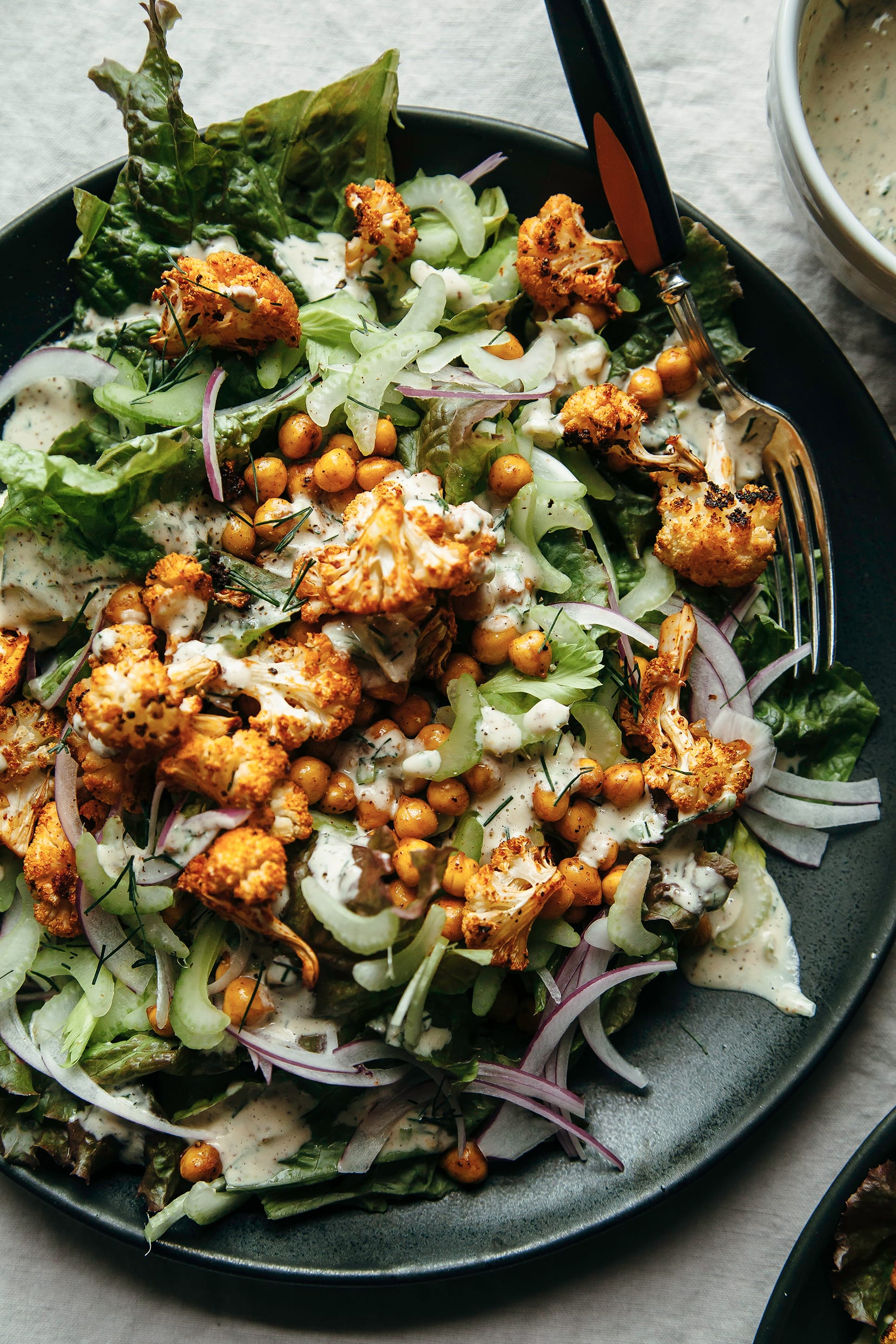 https://thefirstmess.com/wp-content/uploads/2017/07/25-8852-post/vegan-buffalo-cauliflower-salad-tahini-ranch-recipe-9.jpg