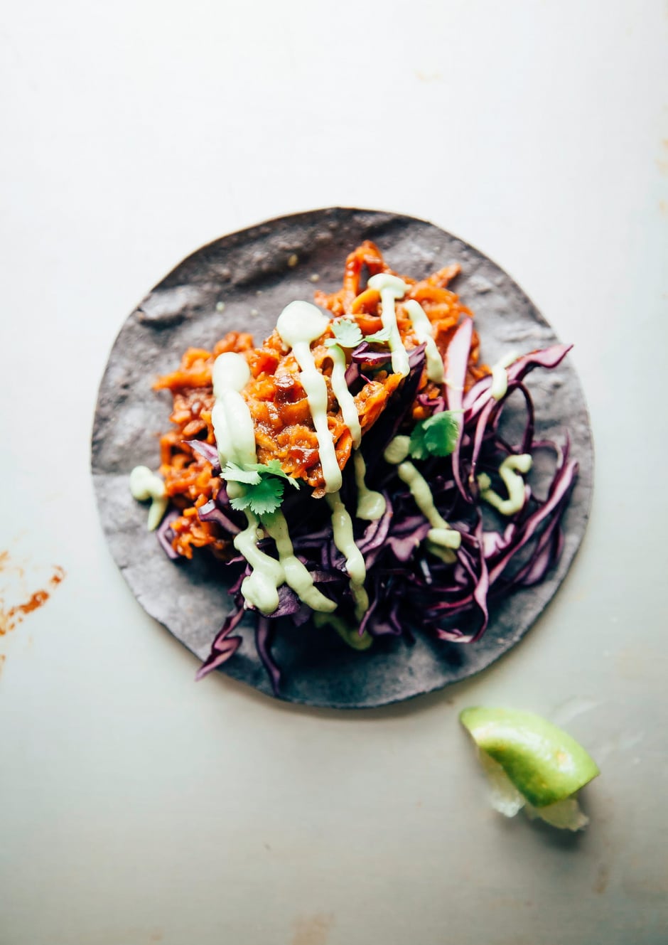 Saucy & Sticky Sweet Potato Tacos with Creamy Cilantro Avocado Sauce - The First Mess