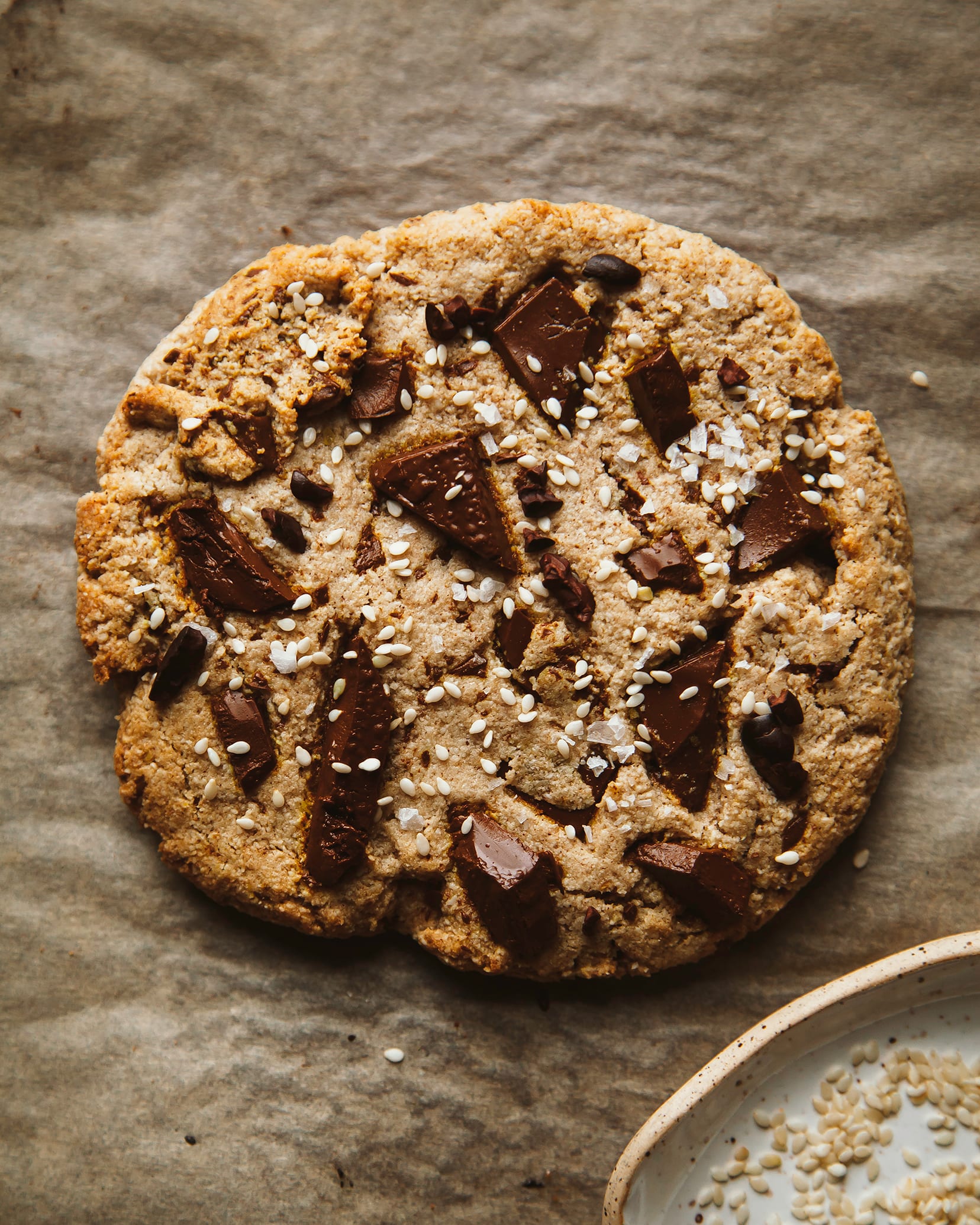 https://thefirstmess.com/wp-content/uploads/2020/02/jumbo-vegan-grain-free-tahini-chocolate-chunk-cookie-recipe-4.jpg