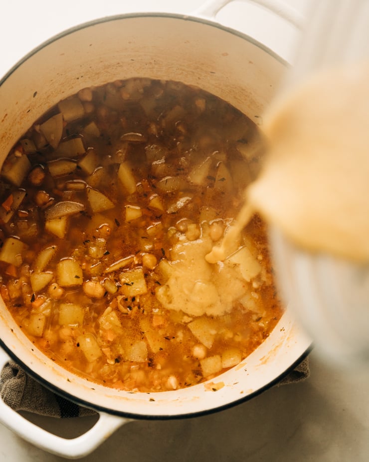 https://thefirstmess.com/wp-content/uploads/2021/10/lemony-chickpea-soup-spinach-potatoes-07-740x925.jpg