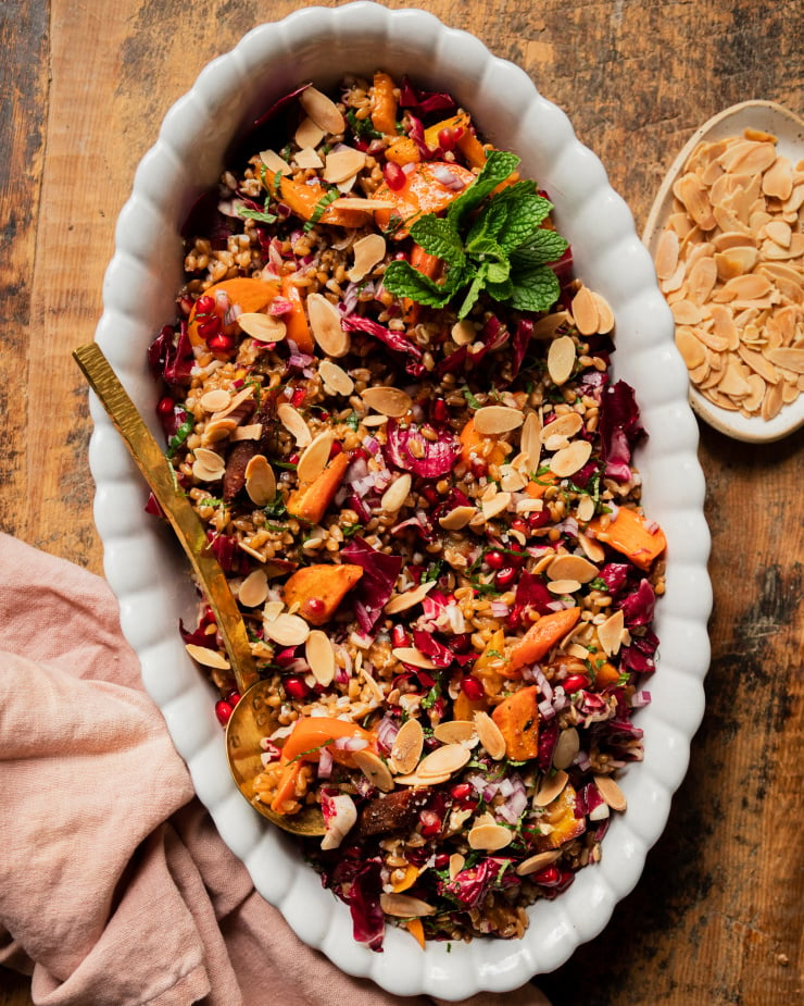 https://thefirstmess.com/wp-content/uploads/2021/11/vegan-holiday-farro-salad-with-roasted-carrots-and-pomegranate-05-740x925.jpg