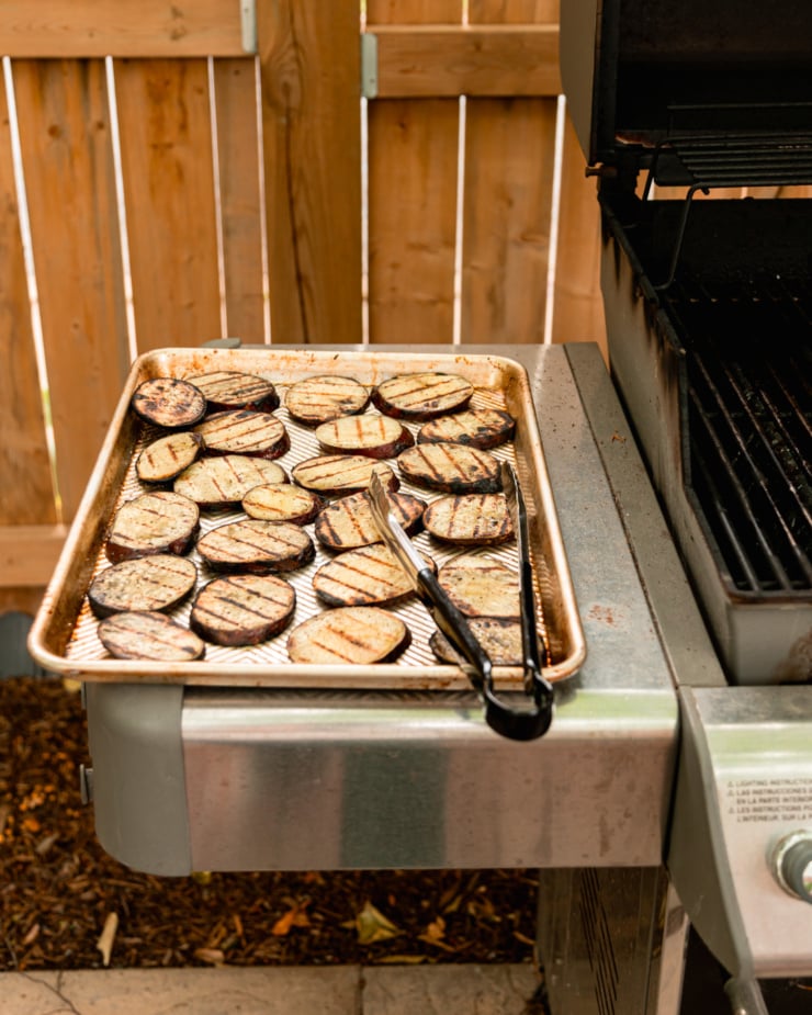 Front shot shows grilling tray on a small table with grill.
