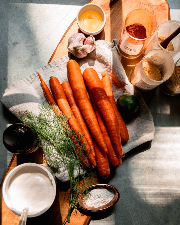 Overhead shots show the ingredients needed for oven-baked carrot fries and creamy yogurt dip.