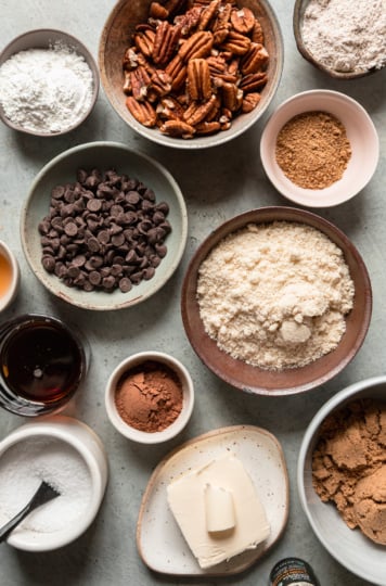 An overhead shot shows an assortment of vegan baking ingredients for a bar recipe.