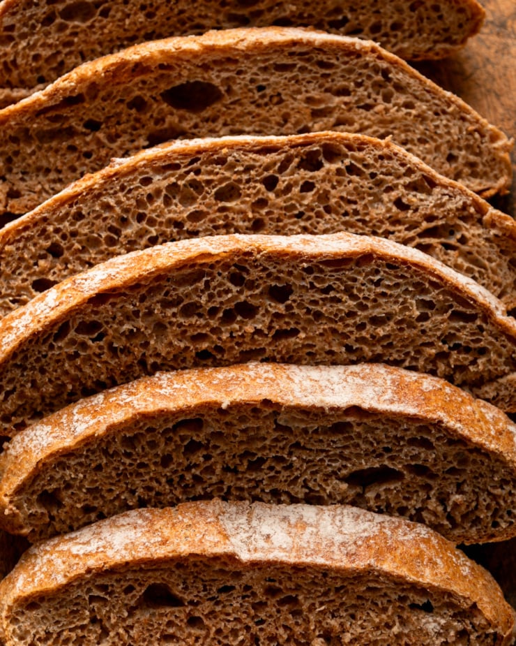 An up close, overhead shot shows sliced no-knead whole wheat bread.