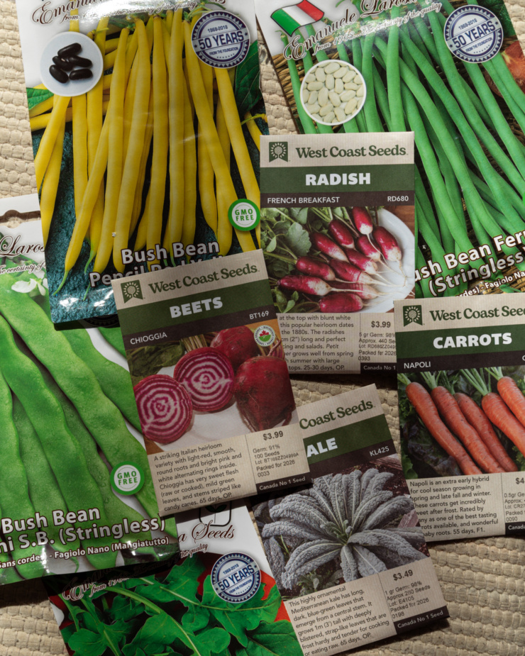 An overhead shot shows a bunch of vegetable seed packets.
