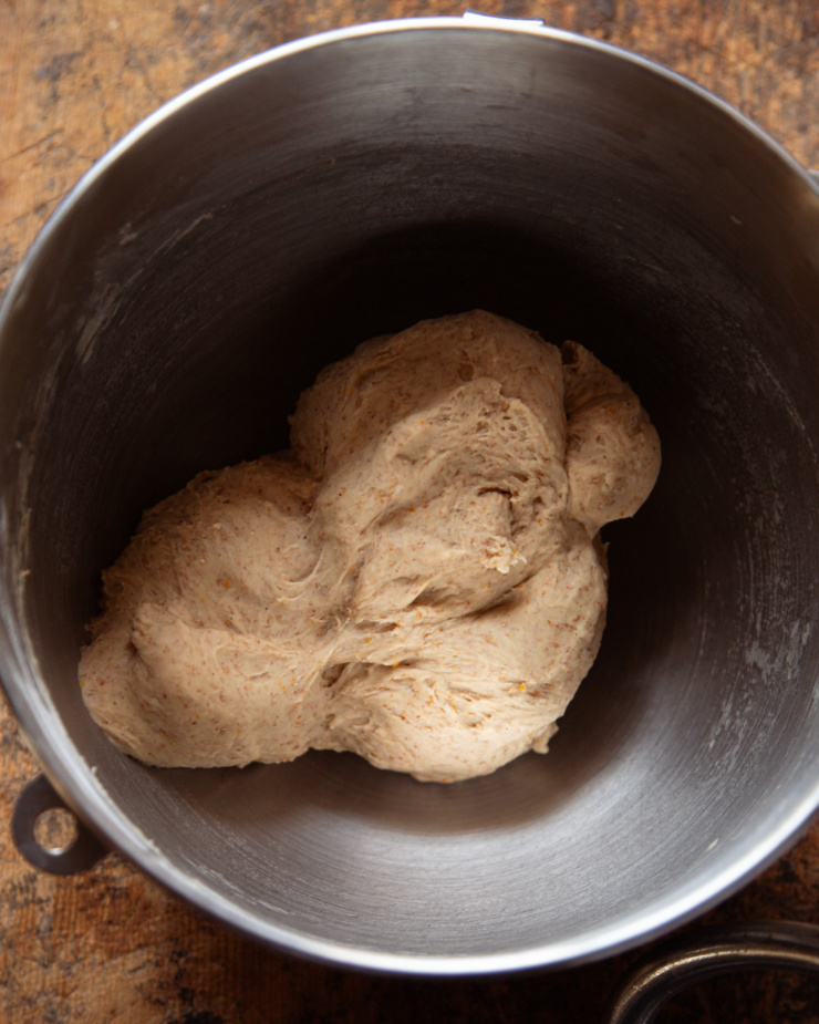 An overhead shot shows a soft dough in a mixing bowl.