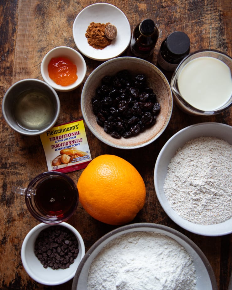 An overhead shot shows the ingredients needed for vegan hot cross buns recipe.